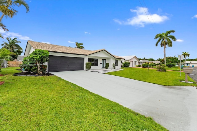 1340 SW 27th Pl, Boynton Beach, FL 33426 - view of front of home featuring an attached garage, concrete driveway, a tiled roof, and stucco siding