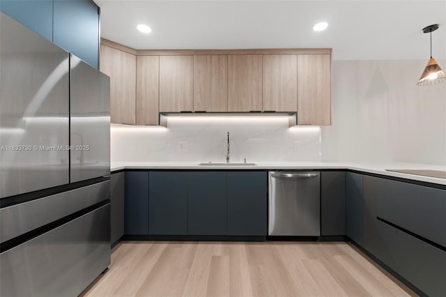 1340 SW 27th Pl, Boynton Beach, FL 33426 - kitchen with appliances with stainless steel finishes, modern cabinets, light brown cabinets, light wood-style floors, and recessed lighting