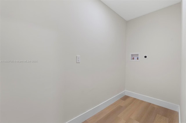 1340 SW 27th Pl, Boynton Beach, FL 33426 - laundry area with hookup for an electric dryer, hookup for a washing machine, and light wood finished floors