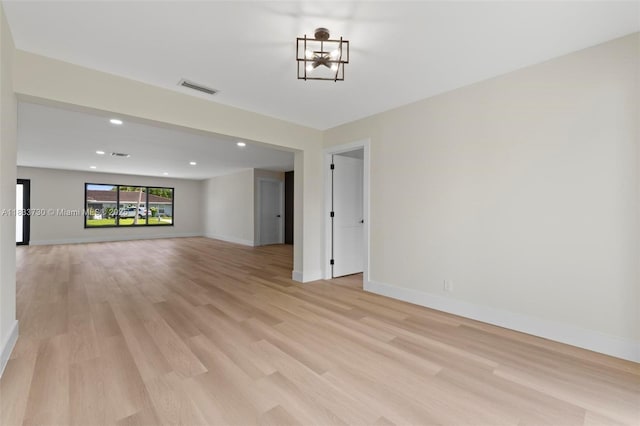 1340 SW 27th Pl, Boynton Beach, FL 33426 - unfurnished living room featuring light wood-style flooring and recessed lighting