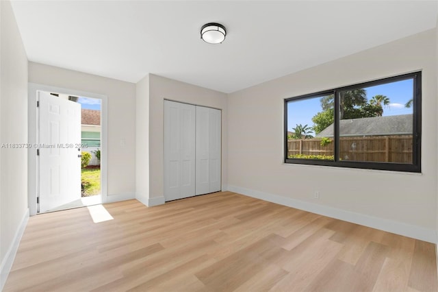 1340 SW 27th Pl, Boynton Beach, FL 33426 - unfurnished bedroom featuring light wood-type flooring and a closet