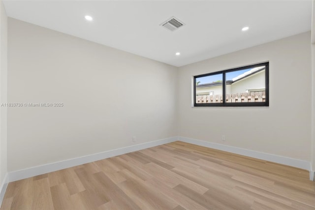 1340 SW 27th Pl, Boynton Beach, FL 33426 - empty room featuring light wood-style floors and recessed lighting
