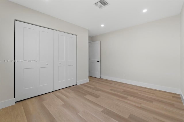 1340 SW 27th Pl, Boynton Beach, FL 33426 - unfurnished bedroom with light wood-type flooring, recessed lighting, and a closet
