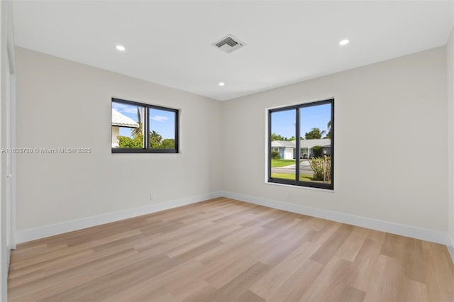 1340 SW 27th Pl, Boynton Beach, FL 33426 - spare room with light wood-style flooring and recessed lighting