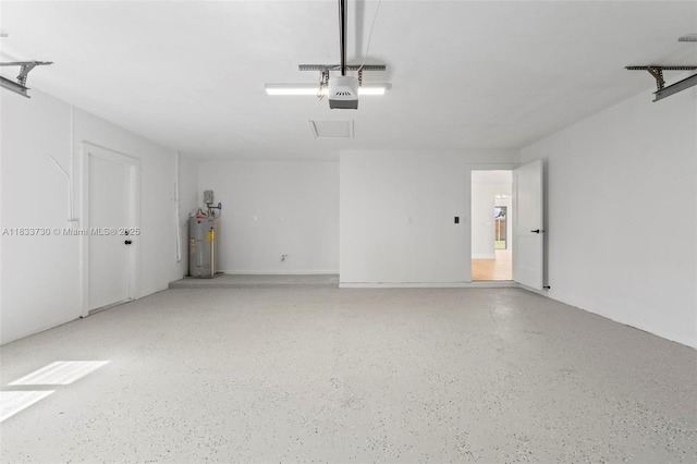 1340 SW 27th Pl, Boynton Beach, FL 33426 - garage with a garage door opener and water heater