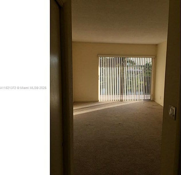 7900 Camino Crk Unit 401, Miami, FL 33143 - unfurnished room featuring carpet flooring