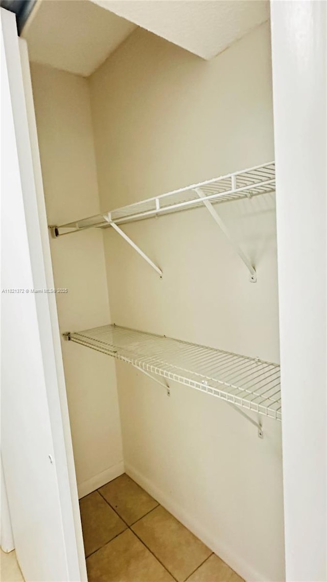 7900 Camino Crk Unit 401, Miami, FL 33143 - spacious closet with light tile patterned floors