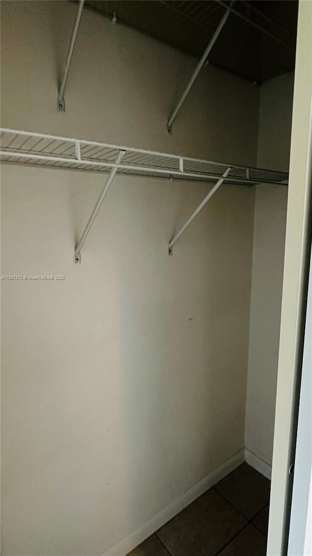 7900 Camino Crk Unit 401, Miami, FL 33143 - spacious closet with dark tile patterned flooring