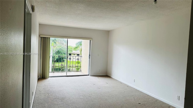 7900 Camino Crk Unit 401, Miami, FL 33143 - spare room with carpet floors and a textured ceiling