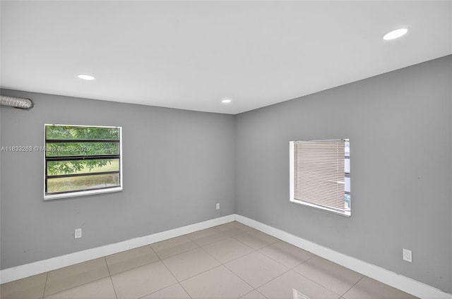 8224 NW 1st Pl, Miami, FL 33150 - tiled empty room featuring recessed lighting