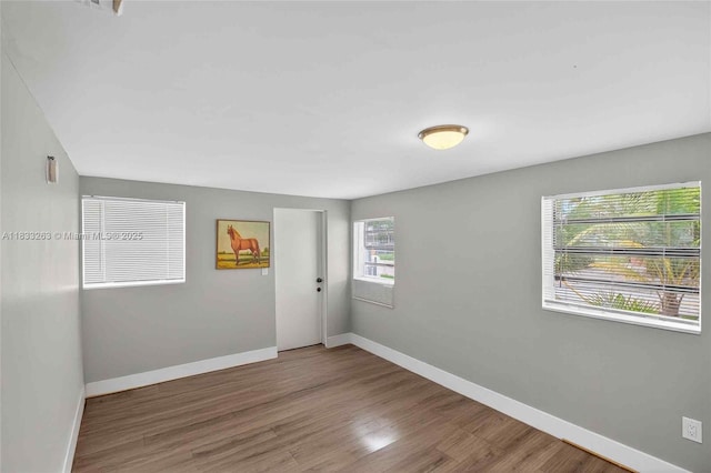 8224 NW 1st Pl, Miami, FL 33150 - spare room with baseboards and wood finished floors