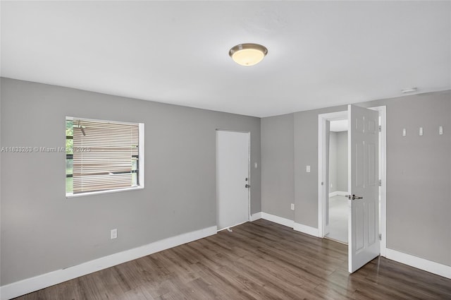 8224 NW 1st Pl, Miami, FL 33150 - spare room with wood finished floors and a smoke detector