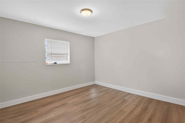 8224 NW 1st Pl, Miami, FL 33150 - spare room with baseboards and light wood finished floors