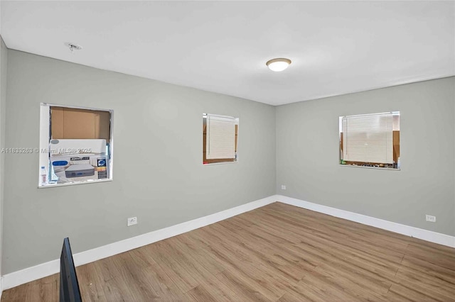8224 NW 1st Pl, Miami, FL 33150 - spare room featuring wood finished floors and baseboards