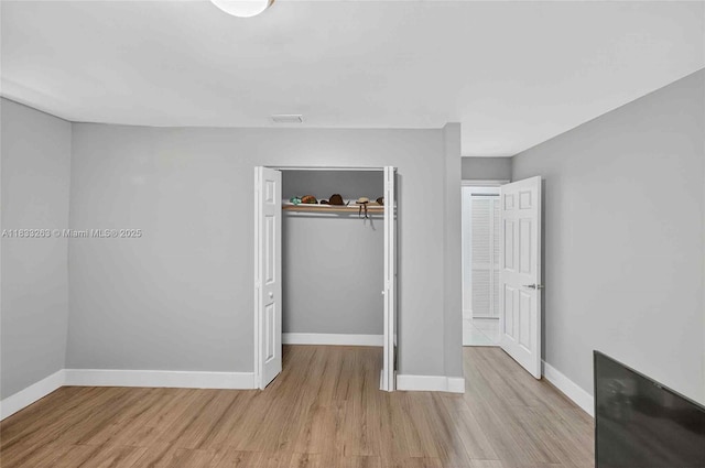 8224 NW 1st Pl, Miami, FL 33150 - unfurnished bedroom with wood finished floors and a closet