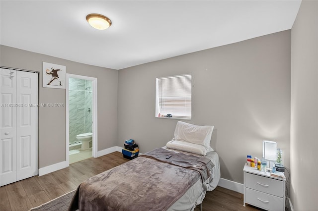 8224 NW 1st Pl, Miami, FL 33150 - bedroom with multiple windows, wood finished floors, ensuite bathroom, and a closet