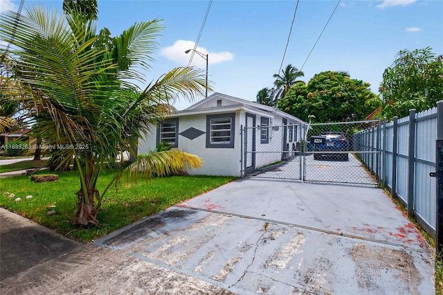 8224 NW 1st Pl, Miami, FL 33150 - view of side of property with a gate, driveway, and stucco siding