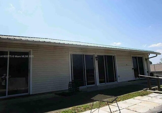 26 Sapphire Run, Ocala, FL 34472 - back of house featuring a metal roof
