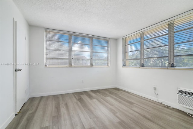 2400 NE 9th St Unit 201, Fort Lauderdale, FL 33304 - empty room with wood finished floors and a textured ceiling