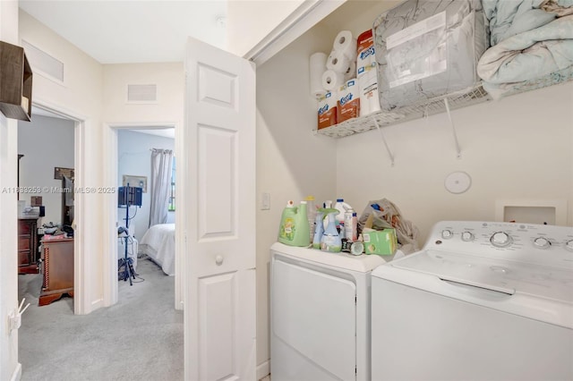 3777 SE 1st St, Homestead, FL 33033 - laundry room featuring washing machine and dryer and light carpet
