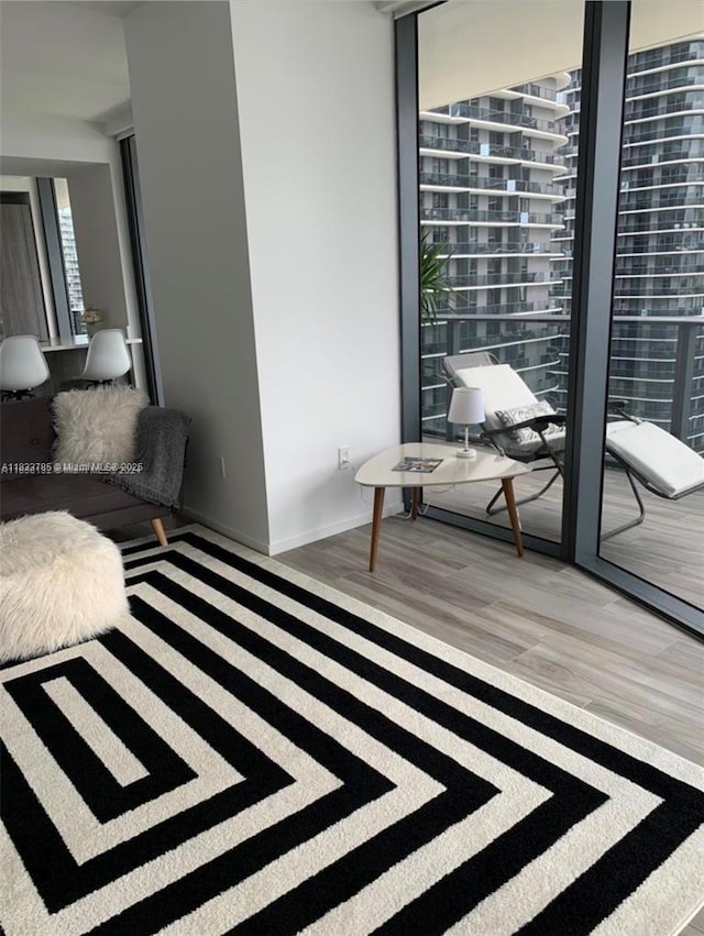 801 S Miami Ave Unit 2609, Miami, FL 33130 - living room featuring light wood-style flooring and baseboards