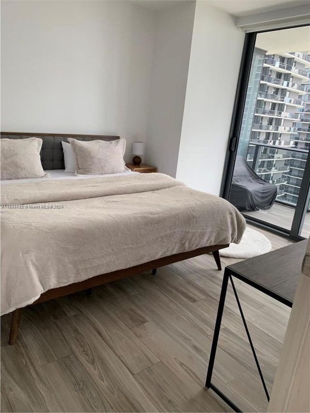 801 S Miami Ave Unit 2609, Miami, FL 33130 - bedroom with wood finished floors and access to outside