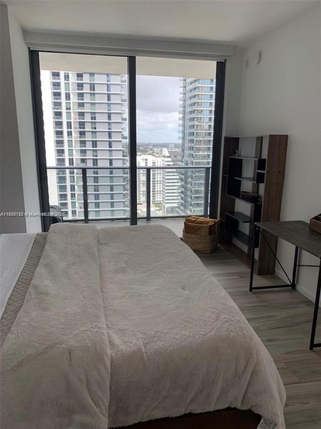 801 S Miami Ave Unit 2609, Miami, FL 33130 - bedroom featuring multiple windows and wood finished floors