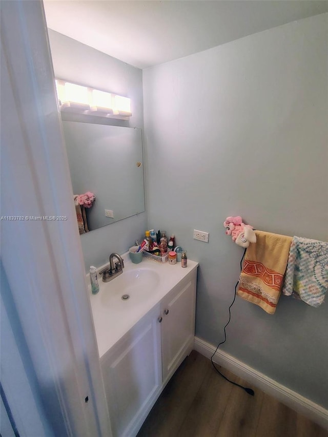 3716 NE 168th St Unit 303, North Miami Beach, FL 33160 - bathroom featuring vanity and wood finished floors