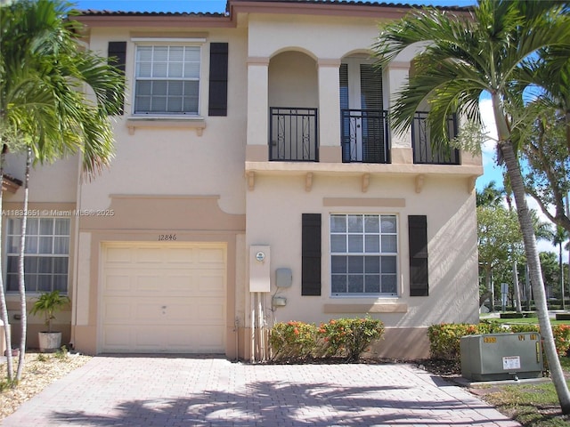 12846 SW 135th St, Miami, FL 33186 - mediterranean / spanish home with a balcony, an attached garage, and stucco siding