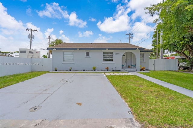20000 SW 114th Ave, Miami, FL 33189 - view of front of home featuring stucco siding, a gate, and covered porch