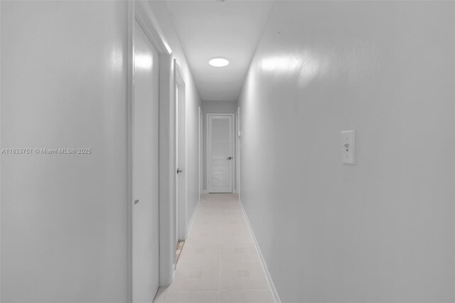 20000 SW 114th Ave, Miami, FL 33189 - corridor with light tile patterned floors and baseboards