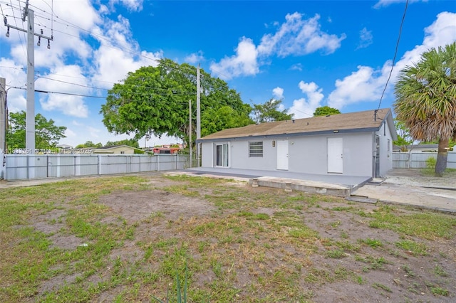 20000 SW 114th Ave, Miami, FL 33189 - back of property with a patio area and stucco siding