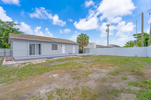 20000 SW 114th Ave, Miami, FL 33189 - rear view of house featuring a fenced backyard and stucco siding