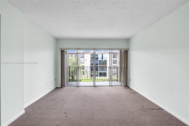 8895 Fontainebleau Blvd Unit 301, Miami, FL 33172 - spare room featuring carpet flooring and a textured ceiling