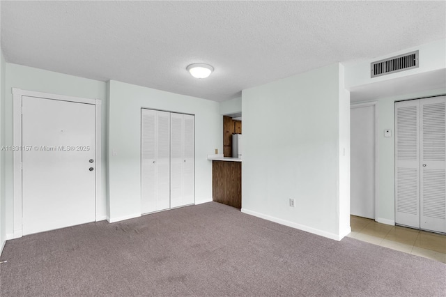 8895 Fontainebleau Blvd Unit 301, Miami, FL 33172 - unfurnished bedroom featuring carpet floors, a textured ceiling, and freestanding refrigerator