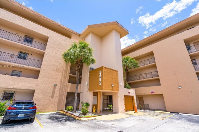8895 Fontainebleau Blvd Unit 301, Miami, FL 33172 - view of apartment building / complex featuring uncovered parking