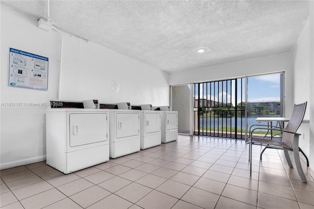 8895 Fontainebleau Blvd Unit 301, Miami, FL 33172 - shared laundry featuring a textured ceiling, light tile patterned flooring, a water view, and independent washer and dryer