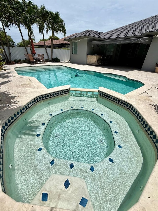 14601 SW 30th St, Miami, FL 33175 - view of pool featuring a patio area and a pool with connected hot tub