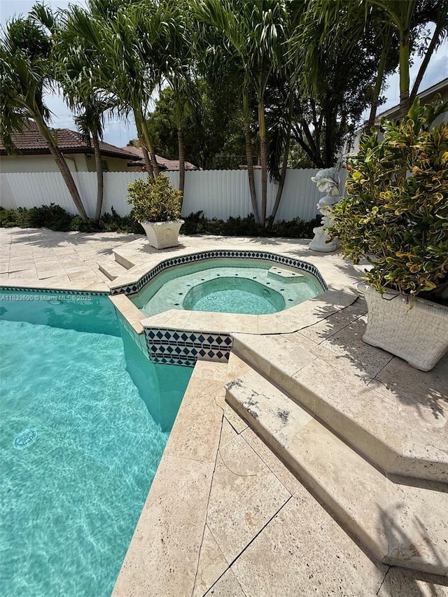14601 SW 30th St, Miami, FL 33175 - view of pool featuring a pool with connected hot tub and a patio area
