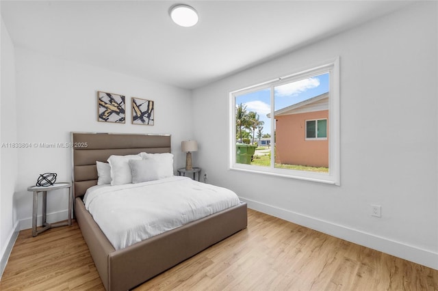 2050 NW 30th Ave, Fort Lauderdale, FL 33311 - bedroom with baseboards and wood finished floors