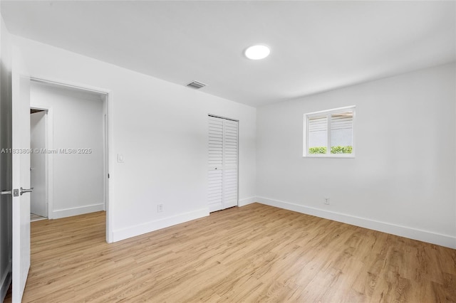 2050 NW 30th Ave, Fort Lauderdale, FL 33311 - unfurnished bedroom with light wood finished floors and a closet