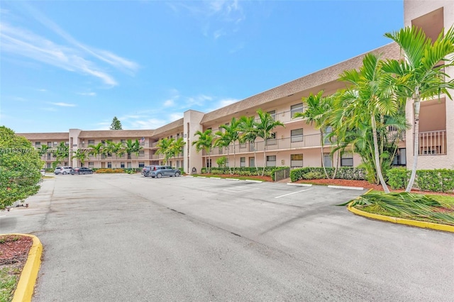 10304 Sunrise Lakes Blvd Unit 209, Sunrise, FL 33322 - view of building exterior featuring uncovered parking