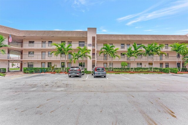 10304 Sunrise Lakes Blvd Unit 209, Sunrise, FL 33322 - view of apartment building / complex with uncovered parking