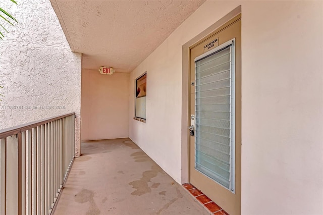 10304 Sunrise Lakes Blvd Unit 209, Sunrise, FL 33322 - property entrance with a balcony and stucco siding