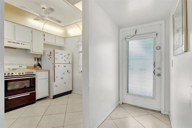 10304 Sunrise Lakes Blvd Unit 209, Sunrise, FL 33322 - kitchen with electric stove, under cabinet range hood, freestanding refrigerator, ceiling fan, and light tile patterned floors