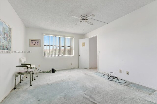 10304 Sunrise Lakes Blvd Unit 209, Sunrise, FL 33322 - unfurnished room featuring ceiling fan, carpet, and a textured ceiling