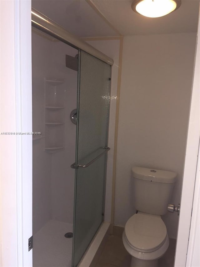 2025 NE 164th St Unit 516, North Miami Beach, FL 33162 - bathroom with a shower stall and toilet