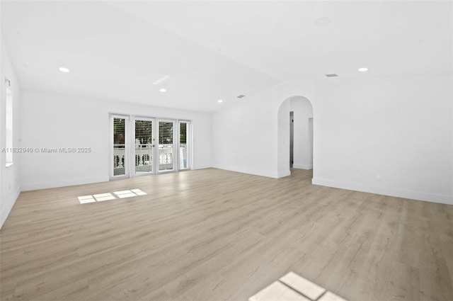 8250 SW 187th St, Cutler Bay, FL 33157 - unfurnished room featuring arched walkways, light wood-style flooring, and recessed lighting