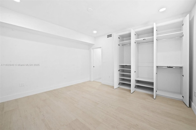 8250 SW 187th St, Cutler Bay, FL 33157 - unfurnished bedroom with wood finished floors, recessed lighting, and multiple closets