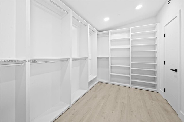 8250 SW 187th St, Cutler Bay, FL 33157 - spare room featuring lofted ceiling, recessed lighting, and wood finished floors